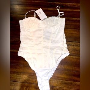 Zara NWT size small bodysuit cream color.